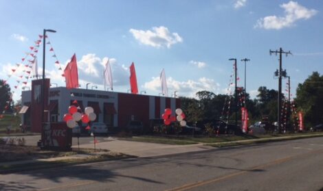 Flags, Duraballoons, and pennant lines grab customers attention!